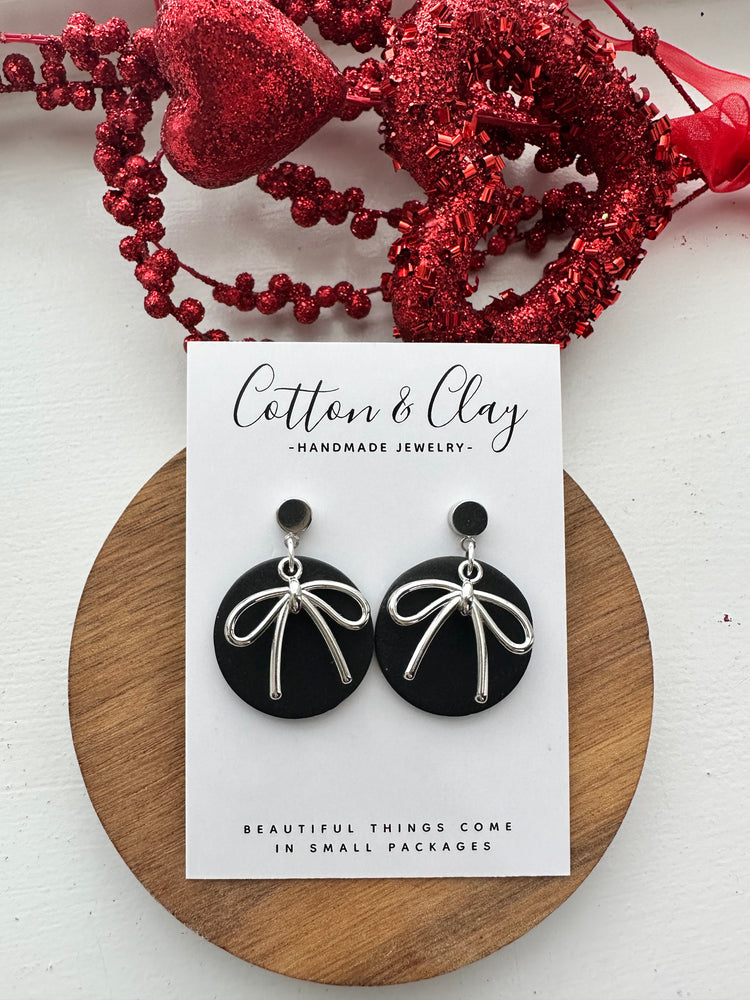Black circle with bow